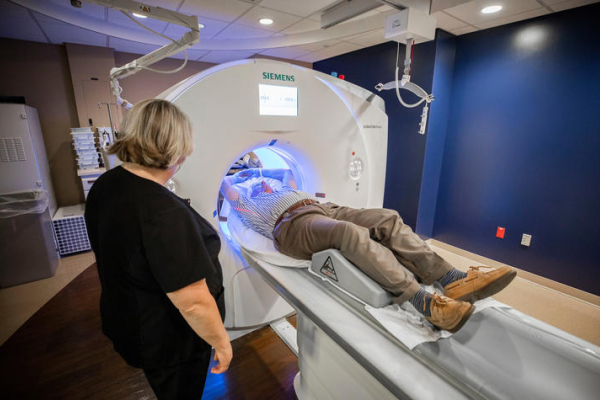 A patient going into a CT scanner