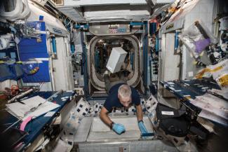 Space Tango CubeLab floats in the International Space Station