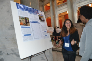 UK Student presents her poster 