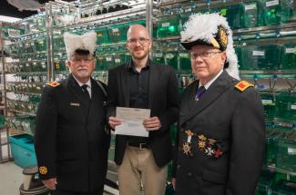 Oliver Voecking presented with check from the Knights Templar Eye Foundation