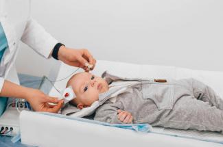 stock image of infant with electrodes being applied for testing