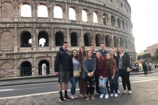 Marilyn Campbell and several of her students in front of the Roman coliseum 