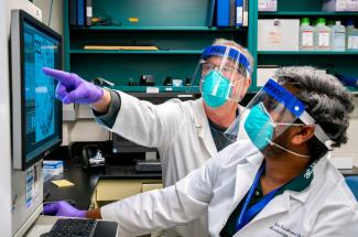 Picture of UK researchers Jerry Woodward and Siva Gandhapudi in their lab