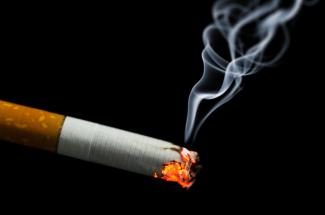 Stock photo of cigarette burning