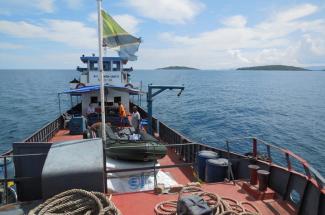 Photo of the research team on a boat on Lake Tanganyika