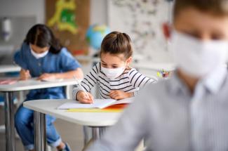 Photo of children in school wearing masks