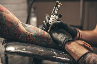 Photo of arm being tattooed