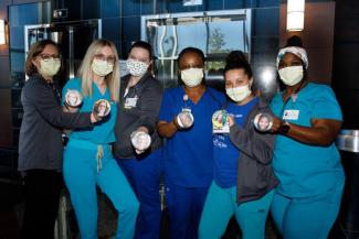 Barnstable Brown Diabetes Clinic uses picture pins so the children know what their caretaker looks like behind the masks. L-R Angela Hepner, Brooke Combs, Shannon O'Mara, Shana Atanga, Brianna Romano, Keila Guy. Mark Cornelison | UK photo