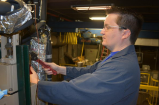 CAER’s Bradley Irvin is principal investigator on the project which aims to make capturing carbon dioxide from coal-fired power plants and industrial facilities significantly less expensive. Photo by Dave Melanson | UK CAER.