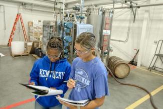 UK Distillation, Wine and Brewing Studies students Johnna Campbell and Riley Neill study their notes on the UltraBlend™ system. Photo by Matt Barton.