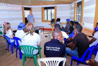 Professor Jeff Seay conducts a training session on the Trash-to-Tank Processor for the staff of Upcycle Africa in Mpigi, Uganda.