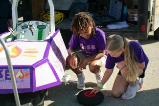 Students on the Rise STEM Academy team prepare for the GEN-EV race at Kroger field June 4. Kirsten Delamarter | Kentucky Energy and Environment Cabinet