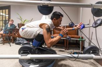 Jockey Rafael Bejarano balances in riding position on an upside-down BOSU ball while SMRI researchers test his reaction time to a series of lights.