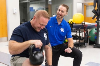 Occupational injuries can hinder the longevity of a firefighter's career. Jake Jelmini and Jen Tinsley are committed to helping local firefighters prevent, identify and treat these injuries. Arden Barnes | UK Photo.