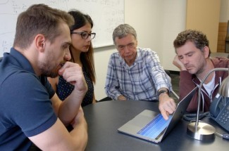 Gary Ferland (center) with students. Ferland has been named a 2022 American Association for the Advancement of Science (AAAS) Fellow for his scientifically and socially distinguished achievements throughout his career.