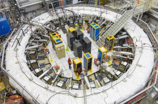 A team from UK, including students and postdocs, made precision measurements in a magnet storage ring as part of Fermilab's muon g-2 experiment. This latest discovery sets up "the ultimate showdown" between theory and experiment. Ryan Postel | Fermilab