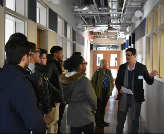 Eduardo Santillan-Jimenez leads trainees through a lab at CAER